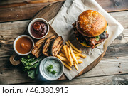 French fries, burger, pork ribs on a stylish board on a wooden background. Fried potatoes. The concept of fast food, junk food and fast food preparation. Стоковое AI-изображение, AI-художник Photojuli / Фотобанк Лори