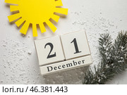 Calendar with date of winter solstice and sun on light background. Стоковое фото, фотограф Pixel_shot / Фотобанк Лори