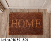 Doormat with word HOME in hall, top view. Стоковое фото, фотограф Pixel_shot / Фотобанк Лори