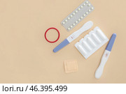 Different contraceptives and pregnancy tests on color background. Стоковое фото, фотограф Pixel_shot / Фотобанк Лори