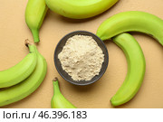 Tasty bananas and bowl with flour on color background. Стоковое фото, фотограф Pixel_shot / Фотобанк Лори