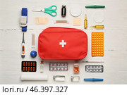 First aid kit on white wooden background. Стоковое фото, фотограф Pixel_shot / Фотобанк Лори