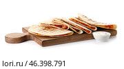 Board with tasty quesadillas and sauce on white background. Стоковое фото, фотограф Pixel_shot / Фотобанк Лори