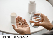 Woman taking pills at home, closeup. Стоковое фото, фотограф Pixel_shot / Фотобанк Лори