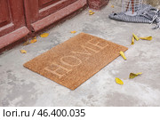 Doormat near entrance of house on autumn day. Стоковое фото, фотограф Pixel_shot / Фотобанк Лори