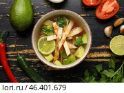Composition with tasty Sopa de Lima soup on dark wooden background. Стоковое фото, фотограф Pixel_shot / Фотобанк Лори