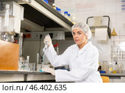 Shot of an young woman using equipment to work in a laboratory. Стоковое фото, фотограф Яков Филимонов / Фотобанк Лори