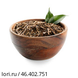 Bowl of dry hojicha green tea on white background. Стоковое фото, фотограф Pixel_shot / Фотобанк Лори