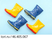 Different gumboots on blue background. Стоковое фото, фотограф Pixel_shot / Фотобанк Лори