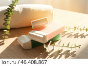 Liposoluble wax cartridges and towel on table. Стоковое фото, фотограф Pixel_shot / Фотобанк Лори