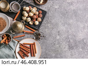 Plate with tasty sweet truffles and cinnamon on grey background. Стоковое фото, фотограф Pixel_shot / Фотобанк Лори