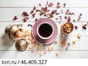Composition with cup of tea and rahat lakoum on white wooden table. Стоковое фото, фотограф Pixel_shot / Фотобанк Лори
