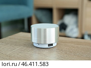 Smart home assistant device on table in room. Стоковое фото, фотограф Pixel_shot / Фотобанк Лори