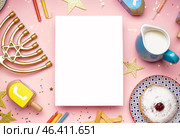 Blank card with menorah, treats, dreidels and stars for Hannukah celebration on pink background. Стоковое фото, фотограф Pixel_shot / Фотобанк Лори
