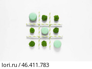 Creative composition with macarons on white background. Стоковое фото, фотограф Pixel_shot / Фотобанк Лори