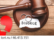 Judge's gavel, broken heart, rings and paper with word DIVORCE on wooden background. Стоковое фото, фотограф Pixel_shot / Фотобанк Лори