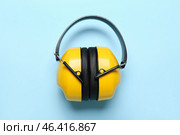 Hearing protectors on blue background. Стоковое фото, фотограф Pixel_shot / Фотобанк Лори