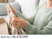 Young woman with received new clothes at home, closeup. Стоковое фото, фотограф Pixel_shot / Фотобанк Лори