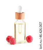 Bottle of raspberry essential oil on white background. Стоковое фото, фотограф Pixel_shot / Фотобанк Лори