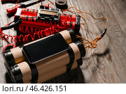 Bomb and tools on wooden background. Стоковое фото, фотограф Pixel_shot / Фотобанк Лори