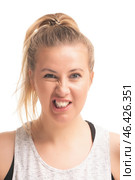 Woman making a funny face in a light background during a casual moment. Стоковое фото, фотограф Гурьянов Андрей / Фотобанк Лори