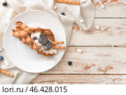 Plate with delicious sweet bubble waffle on table. Стоковое фото, фотограф Pixel_shot / Фотобанк Лори
