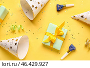 Different party decor on yellow background. Стоковое фото, фотограф Pixel_shot / Фотобанк Лори