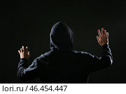 Профессиональный хакер на темном фоне, вид сзади. Стоковое фото, фотограф Pixel_shot / Фотобанк Лори
