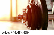 Barbell in the gym at dawn with a pred workout. Стоковое фото, фотограф Igor Skripachev / Фотобанк Лори