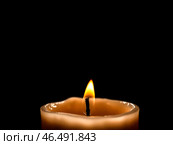 Горящая свеча на черном фоне. Символ света вечного огня, поминовения усопших, молитвы за близких./ Burning candle isolated on black background. Symbol of the light of the eternal flame. Стоковое AI-изображение, AI-художник Iva Noel / Фотобанк Лори