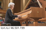Elderly pianist performing classical music on grand piano. Стоковое AI-видео, аниматор Юрий Поздников / Фотобанк Лори