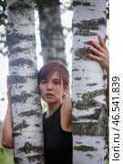 Beautiful woman with an emotional expression on the background of birches, embodying harmony with nature. Стоковое фото, фотограф Юрий Поздников / Фотобанк Лори