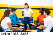 Portrait of delighted girl student with her groupmates and female teacher in auditorium. Стоковое фото, фотограф Яков Филимонов / Фотобанк Лори