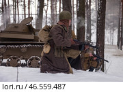 Sestroretsk, Russia - February 19, 2023: Soldiers engage in tactical maneuvers during winter conditions, showcasing the resilience and strategy of WWII combat. Редакционное фото, фотограф Aleksandr Golubev / Фотобанк Лори