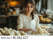 A young girl in old country style clothes, in a white shirt and apron, stands at the table, preparing dough. Her hands are covered in flour, and in front of her are several prepared bread products. Her gaze is calm and focused, and the background is filled with warm homely light, creating a cozy atmosphere of a country bakery. Around you can see other baked goods, wooden dishes and kitchen utensils. Стоковое AI-изображение, AI-художник Анна Кривицкая / Фотобанк Лори
