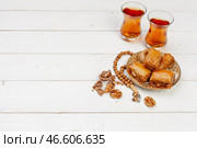 Cup of hot tea and a plate of turkish desserts. Стоковое фото, фотограф Сергей Толмачёв / Фотобанк Лори
