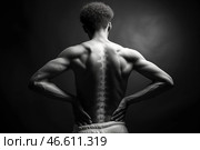 Lumbar intervertebral spine hernia, man with back ache suffers from pain on black background, spinal disc disease. Стоковое AI-изображение, AI-художник Станислав Тарко / Фотобанк Лори
