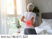Back pain, kidney inflammation, elderly woman suffering from backache at home. Стоковое AI-изображение, AI-художник Станислав Тарко / Фотобанк Лори