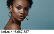 Beautiful portrait of a natural African-American girl on a neutral blue background. Cosmetology, skin care, facial care and makeup. Стоковое AI-изображение, AI-художник Photojuli / Фотобанк Лори