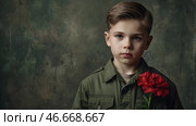 The concept of the May 9th holiday. Portrait of a handsome boy in khaki clothes with red carnation flowers. Celebration of Victory Day 1941-1945. Стоковое AI-изображение, AI-художник Photojuli / Фотобанк Лори