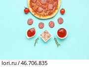Композиция с вкусной пиццей пепперони и ингредиентами на бирюзовом фоне. Стоковое фото, фотограф Pixel_shot / Фотобанк Лори