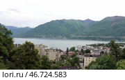 Озеро Маджоре и город Локарно в пасмурный день. Швейцария. Май. Lake Maggiore and the city of Locarno on a cloudy day. Switzerland. May. Стоковое видео, видеограф Горшков Александр / Фотобанк Лори