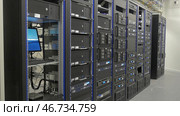 Storage servers are located in the server room of the data center. Стоковое фото, фотограф David Kashakhi / Фотобанк Лори