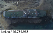 Mysterious view of old ship washed up on shore. Стоковое фото, фотограф David Kashakhi / Фотобанк Лори