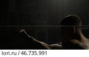 Boxer doing exercises with a rope for slope, dives and punches. Стоковое фото, фотограф David Kashakhi / Фотобанк Лори
