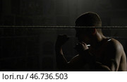 Boxer doing exercises with a rope for slope, dives and punches. Стоковое фото, фотограф David Kashakhi / Фотобанк Лори