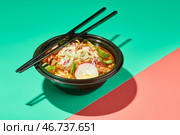 Birria ramen, consomme soup with beef and noodle. Mix of Mexican and Asian cuisine. Стоковое фото, фотограф Ирина Буракова / Фотобанк Лори