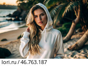 Beautiful young woman in a white hoodie on the beach. Template layout for hoodie design, print area layout for logo or design. Стоковое AI-изображение, AI-художник Photojuli / Фотобанк Лори