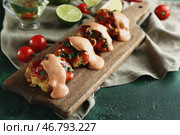 Вкусные колбасные шарики с соусами на деревянной доске. Стоковое фото, фотограф Pixel_shot / Фотобанк Лори