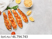 Лодочки из кабачков, фаршированные мясом, на светлом фоне. Стоковое фото, фотограф Pixel_shot / Фотобанк Лори